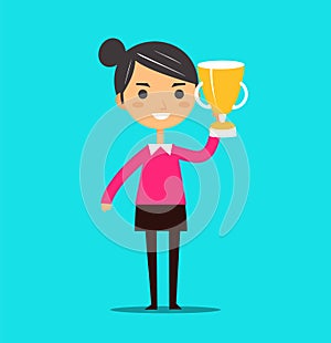 Young Asian woman holding trophy with a big smile, standing against a blue background. Success and achievement concept