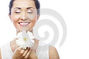 Young asian woman holding white gerber flower