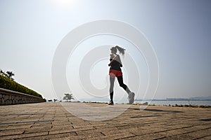 Young asian woman jogging outdoors