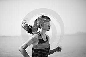 Young asian woman jogging outdoors