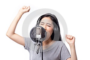 Young asian woman with microphone recording song in music studio happy expression face isolated on white background