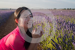 Young Asian woman outdoors at lavender flowers field - happy and beautiful Korean girl in sweet Summer magenta dress enjoying