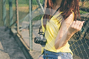 Young asian woman photographer tourist girl posing outdoor