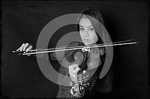 Young asian woman playing violin