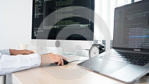 Young Asian woman Programmer Typing code working with computer at table, coding cyberspace and Web Development Concept