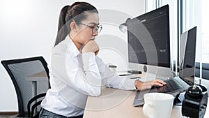 Young Asian woman Programmer Typing code working with computer at table, coding cyberspace and Web Development Concept