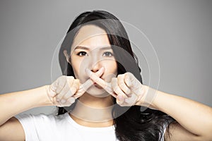 young asian woman with prohibit gesture