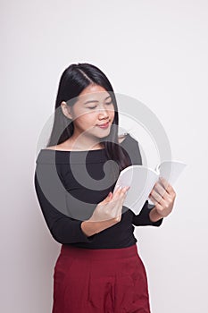 Young Asian woman read a book.