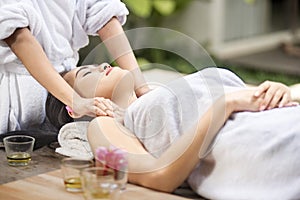 Young asian woman receiving body massage