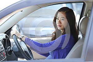 Young Asian woman ride a car, on traffic
