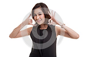 Young Asian woman show with phone gesture and OK sign.