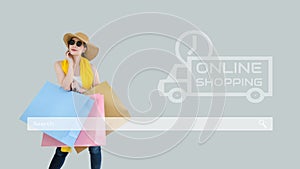 Young asian woman showing shopping bags with search bar. Concept of online shopping, e-marketplace business, E-commerce and