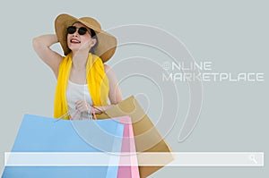 Young asian woman showing shopping bags with search bar. Concept of online shopping, e-marketplace business, E-commerce and