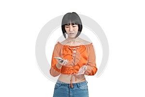 Young asian woman shrugging with her smartphone, isolated.