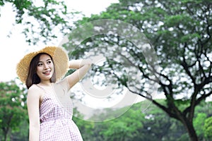 Young Asian woman is smile and feeling relax with nature