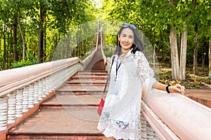 Young Asian Woman Smile at Khao Kradong Forest Park, The long extinct volcano in Buriram, Thailand