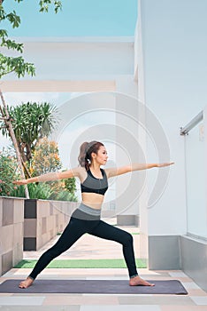 Young asian woman in sport wear doing sports outdoors