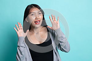 Young Asian woman sticking her  tongue out