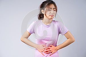 Young asian woman suffering from gastritis