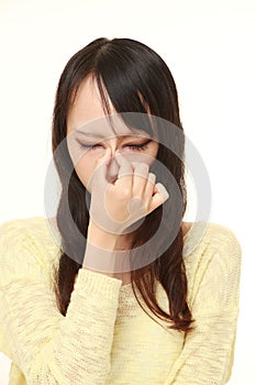 Young Asian woman suffers from Asthenopia photo