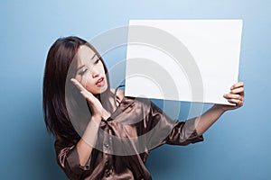 Young Asian woman surprise with white blank sign.