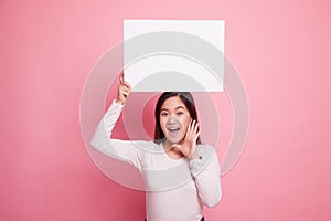 Young Asian woman surprise with white blank sign.