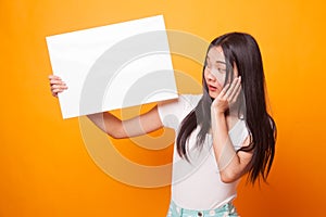 Young Asian woman surprise with white blank sign.