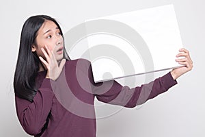 Young Asian woman surprise with white blank sign