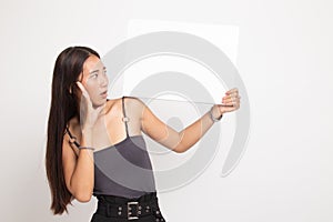 Young Asian woman  surprise with  white blank sign