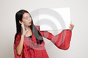 Young Asian woman  surprise with  white blank sign