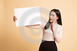 Young Asian woman  surprise with  white blank sign