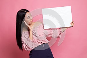 Young Asian woman  surprise with  white blank sign