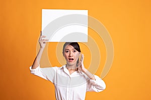 Young Asian woman surprise with white blank sign