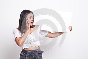 Young Asian woman  surprise with  white blank sign