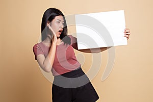 Young Asian woman  surprise with  white blank sign