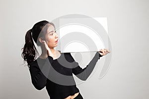 Young Asian woman  surprise with  white blank sign