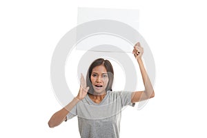 Young Asian woman surprise with white blank sign.