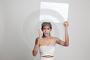 Young Asian woman surprise with white blank sign.