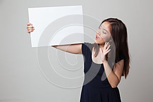 Young Asian woman surprise with white blank sign.