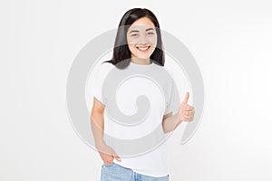 Young asian woman in template blank t shirt showing big thumb up isolated on white background. Happy and success concept.