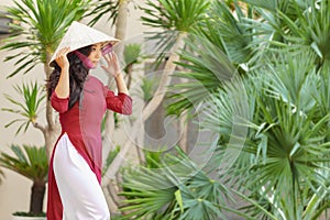 Young asian woman in traditional vietnamese dress ao dai