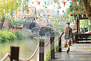 Young asian woman traveler with backpack and mask traveling alone in the afternoo. Lady traveler tourist