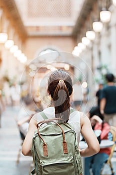 Young asian woman traveler in Yellow dress with bag traveling to NIMMAN on Nimmanhaemin Road, Tourist visit at the Night market