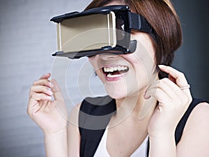 Young asian woman trying VR glasses