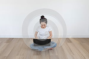 Young Asian woman using computer laptop