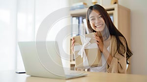 Young asian woman using computer laptop at home
