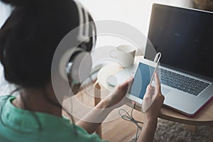 Young Asian woman using laptop computer