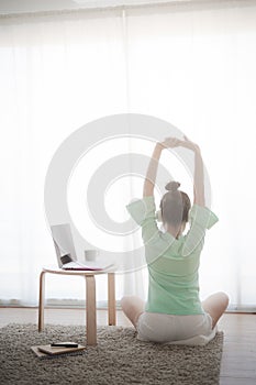 Young Asian woman using laptop computer