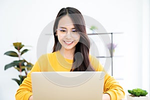 Young asian woman using laptop at house. Work at home, Video conference, Online meeting video call