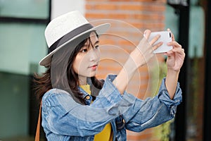 Young asian woman using smart phone in city outdoors background, people outdoor with technology, people on phone, lifestyle